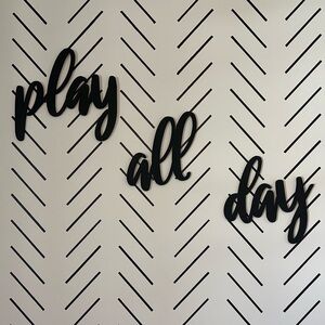 “Play All Day” word wall decor.